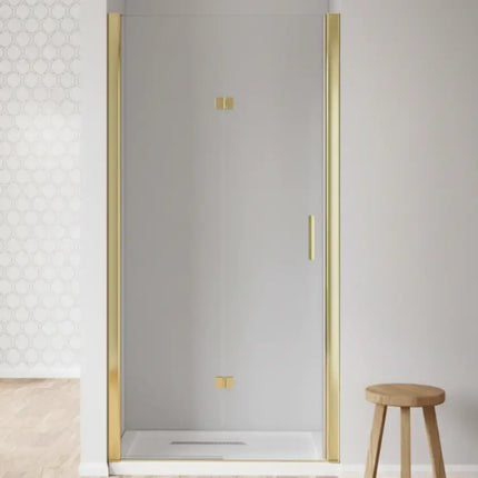 Porta doccia a libro H190 profili oro in nicchia bianca minimalista: singola anta aperta con maniglia verticale dorata e piatto doccia bianco