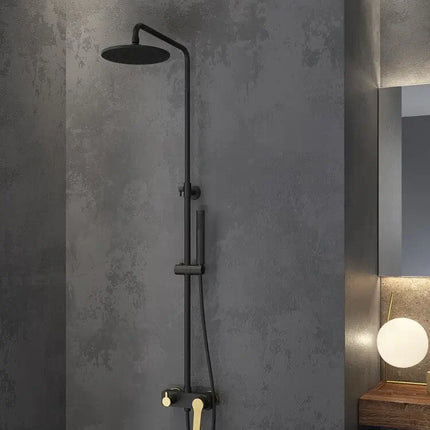 Colonna doccia termostatica nero e oro con soffione rotondo in bagno moderno