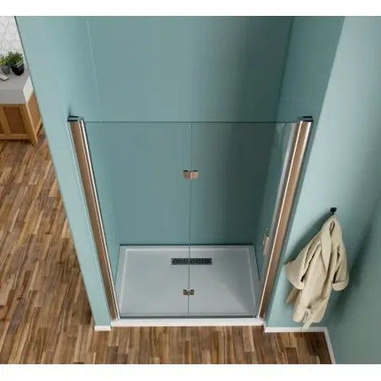 Porta doccia libro trasparente 6mm H190 vista dall'alto: doppia anta aperta a soffietto con profili cromati e piatto doccia rettangolare